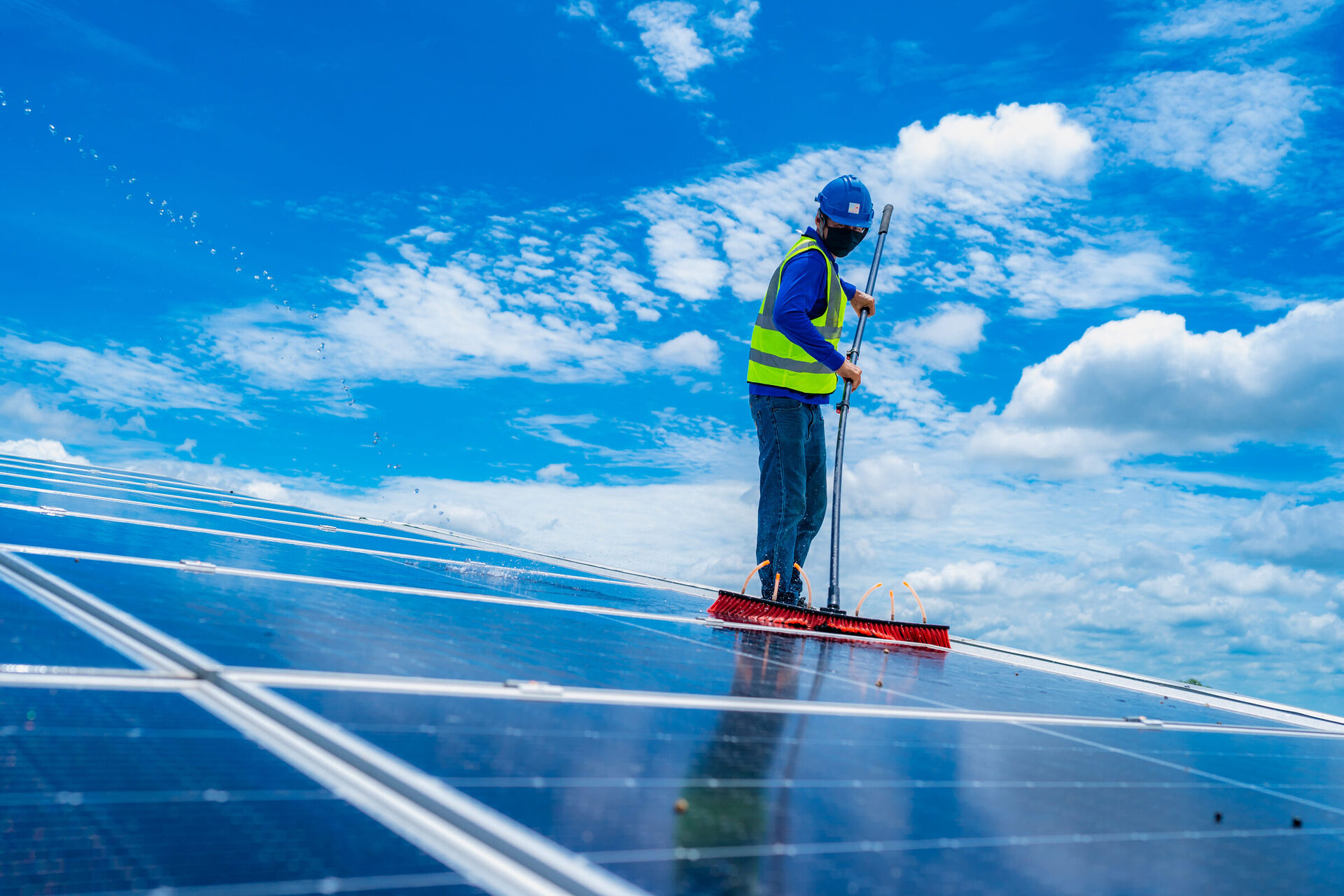 Close-up of a solar panel being professionally cleaned